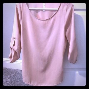 Iight pink blouse with gold button and back detail
